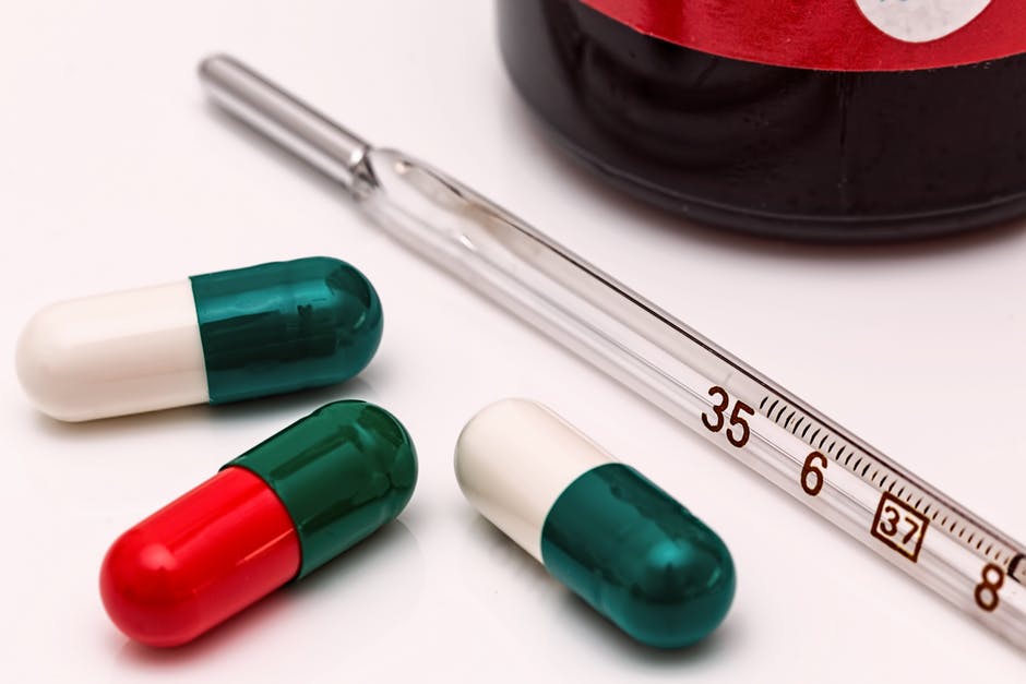 health pills and syringe