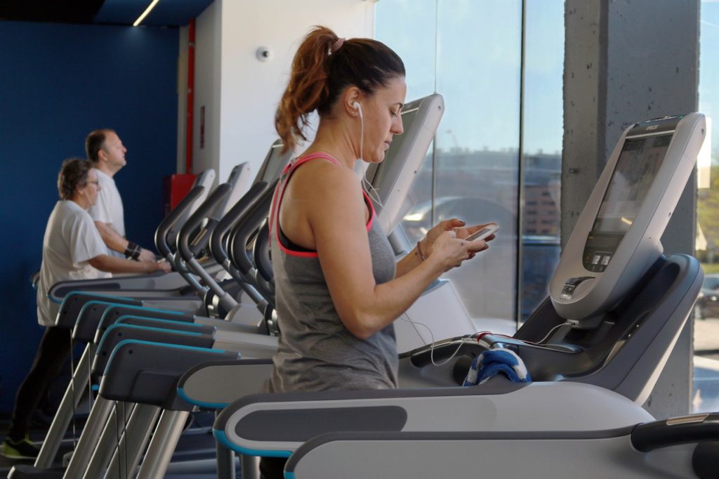 woman on treadmill gym essentials