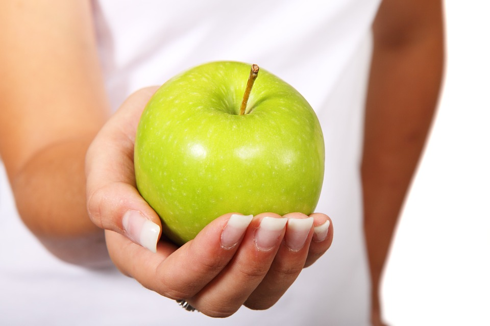 Diet apple in hand